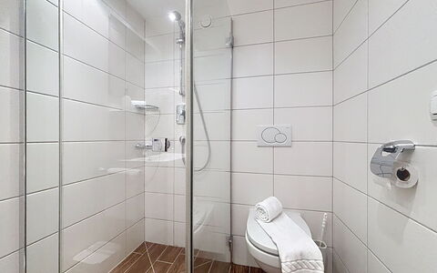 Susi: Flooring, Floor, Shower, Shower Door, Plumbing, Bathroom, Plumbing Fixture, Shower Head, Tile