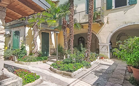 Le Falesie: Arch, Flowerpot, Hacienda, Courtyard, Houseplant, Shade, Flagstone, Landscaping