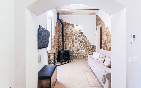 La Terrazza di Caramanico: Wall, Flooring, Interior Design, Floor, Ceiling, Room, Stone Wall, Living Room, Couch
