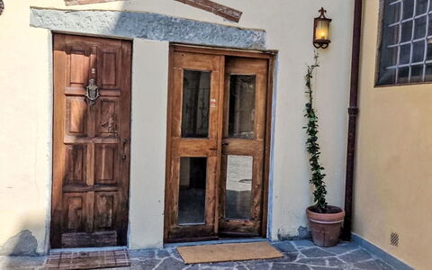 Il Pozzo dei Desideri: Wall, Wood, Door, Home Door, Floor, Hardwood, Wood Stain, Concrete, Door Handle, Flowerpot