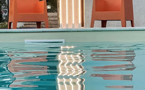 La Perla di Aprilia: Orange, Swimming Pool, Wood Stain, Outdoor Furniture, Outdoor Structure