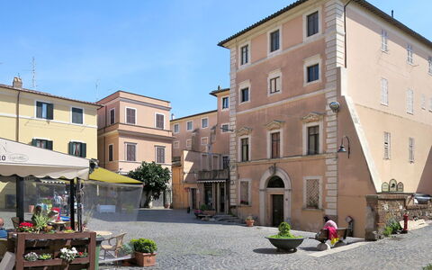 La Perla di Aprilia: Window, Town, Flowerpot, Balcony, Courtyard, Houseplant, Driveway, Umbrella