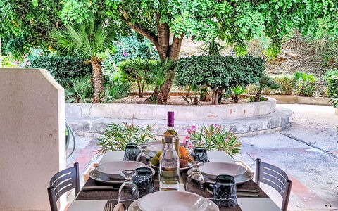 Cala Isulidda: Furniture, Table, Chair, Outdoor Table, Kitchen & Dining Room Table, Restaurant, Outdoor Furniture, Garden, Shade, Backyard