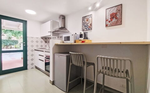 Cala Isulidda: Kitchen, Kitchen Appliance, Interior Design, Major Appliance, Flooring, Furniture, Wood, Countertop, Floor, Ceiling