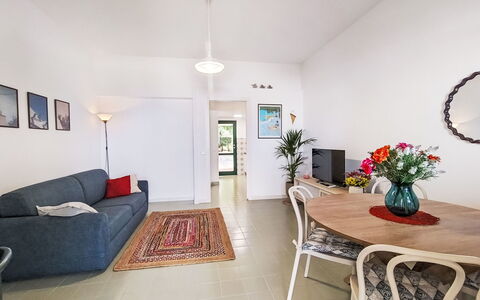 Cala Isulidda: Flooring, Interior Design, Furniture, Floor, Ceiling, Couch, Room, Living Room, Table, Apartment