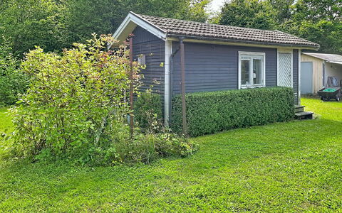 Lötstugan: Grass, Shrub, House, Cottage, Garden, Roof, Home, Siding, Land Lot