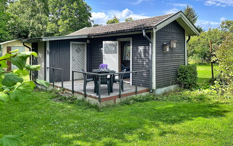 Lötstugan: House, Cottage, Shrub, Home, Roof, Porch, Siding, Door, Garden Buildings
