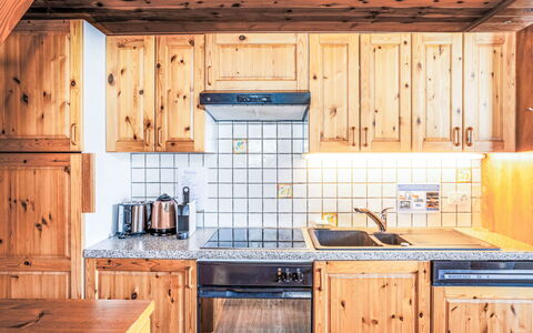 Les Marmottes: Wood, Kitchen, Cabinetry, Major Appliance, Wood Stain, Countertop, Freezing, Snow, Hardwood, Kitchen Appliance