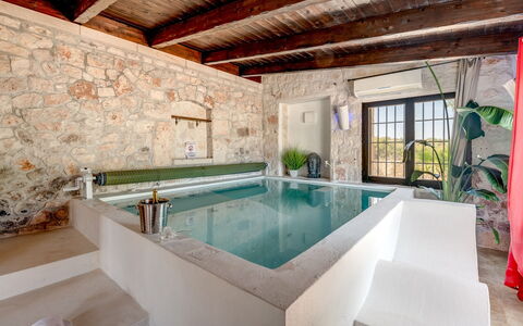 Trulli Littoria 4: Wall, Swimming Pool, Furniture, Flooring, Architecture, Resort, Floor, Composite Material, Plumbing Fixture, Bathtub