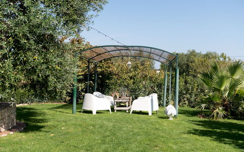 Trulli Littoria 4: Garden, Shrub, Shade, Gazebo, Outdoor Structure, Pavilion, Landscaping, Canopy, Backyard, Lawn
