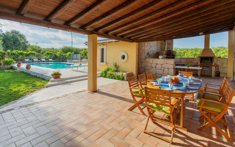 Il Giardino dei Limoni 8: Furniture, Swimming Pool, Flooring, Outdoor Furniture, Resort, Chair, Floor, Shade, Kitchen & Dining Room Table, Flagstone