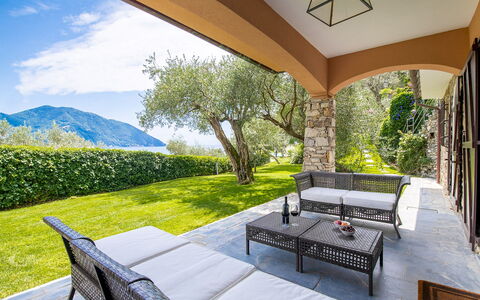 Villa Baia Blu 12: Furniture, Chair, Resort, Outdoor Furniture, Shade, Eco Hotel, Garden, Estate, Porch, Balcony