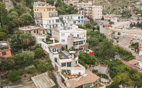 Attico Giafari 6: Wall, Building, Residential Area, House, Home, Town, Architecture, Neighbourhood, Apartment, Roof