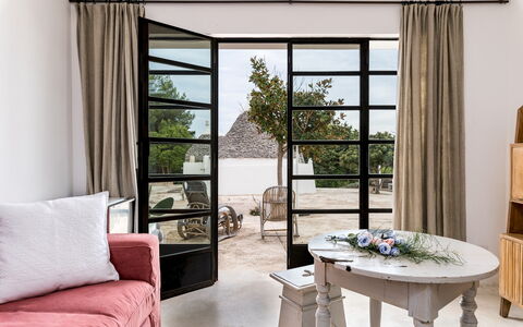 Trullo Santa Pazienza 6+3: Furniture, Interior Design, Wood, Flooring, Floor, Room, Lighting, Home, Door, Living Room