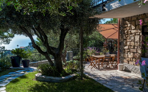 Villa nel Blu 8: Furniture, Chair, Outdoor Furniture, Garden, Shade, Outdoor Table, Backyard, Yard, Landscaping, Patio