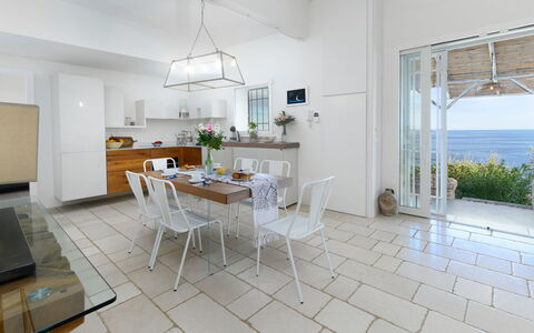 Villa Soleluna 7+1: Furniture, Chair, Flooring, Interior Design, Table, Floor, Kitchen & Dining Room Table, Lighting, Room, Dining Room