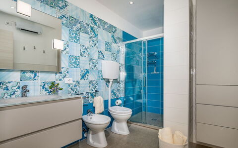Dama dei Venti 6+2: Blue, Plumbing Fixture, Flooring, Floor, Interior Design, Bathroom, Sink, Tile, Toilet, Plumbing