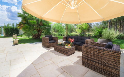 Villa la Dolce Vita 6: Umbrella, Garden, Chair, Shade, Flowerpot, Outdoor Furniture, Flagstone, Landscaping, Houseplant, Eco Hotel