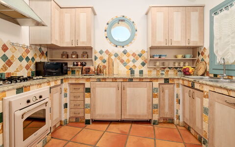 Villa Typha 10: Kitchen, Wood, Flooring, Interior Design, Floor, Countertop, Tile, Room, Cabinetry, Kitchen Appliance