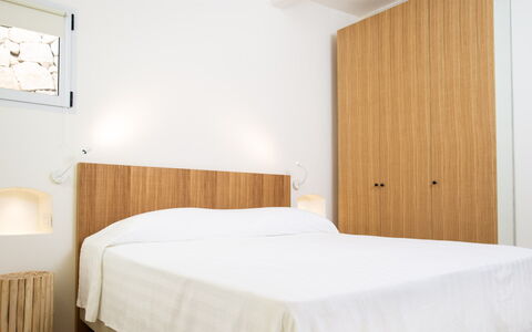 Villa Anga 10+1: Wall, Bedroom, Wood, Interior Design, Bed, Furniture, Flooring, Floor, Bedding, Bed Sheet
