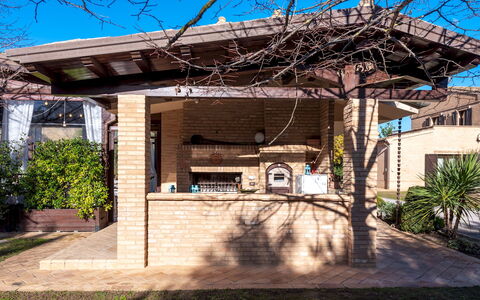 Villa Isotta 8+4: Furniture, Roof, Shade, Porch, Outdoor Structure, Backyard, Garden, Wood Stain, Patio, Outdoor Furniture