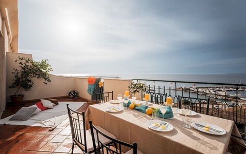 Nova Domus 6: Sea, Furniture, Table, Chair, Kitchen & Dining Room Table, Ocean, Balcony, Coast, Resort, Flowerpot