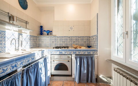 Tenuta Cavi 10: Flooring, Floor, Interior Design, Tile, Room, Kitchen, Major Appliance, Molding, Countertop, Wood Stain