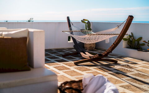 Kyvos 10: Furniture, Outdoor Furniture, Sea, Chair, Ocean, Wicker, Shade, Coast, Balcony, Hardwood