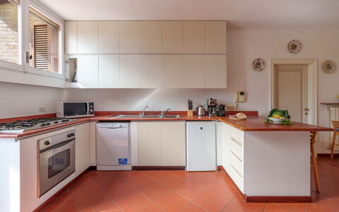 Villa Lia 10: Kitchen Appliance, Kitchen, Countertop, Major Appliance, Cabinetry, Flooring, Interior Design, Wood, Home Appliance, Kitchen Stove