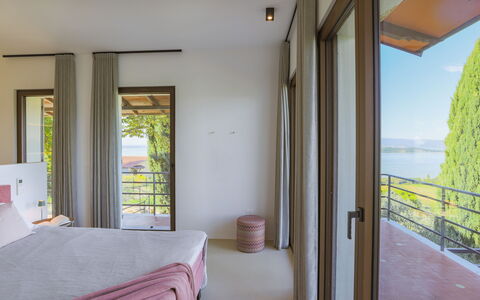 Casa dei Fiamminghi 10+2: Balcony, Eco Hotel, Shade, Wood Stain, Ocean, Resort, Hardwood, Coast, Porch, Chair