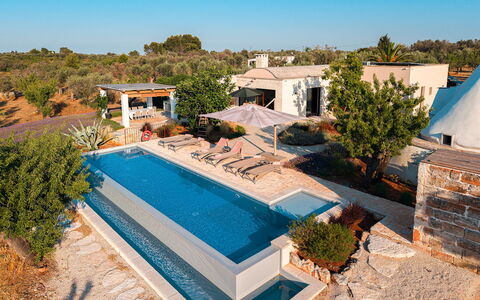 Trulli Fiori di Mandorlo 6: Swimming Pool, Resort, Umbrella, Outdoor Furniture, Eco Hotel, Sunlounger, Estate, Water Feature, Villa, Shade