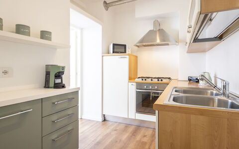 Genzianella Alpine Apartment: Flooring, Floor, Ceiling, Interior Design, Countertop, Kitchen, Cabinetry, Room, Major Appliance, Light Fixture
