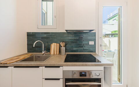 Contemporary House: Kitchen, Countertop, Kitchen Appliance, Flooring, Interior Design, Major Appliance, Wood, Cabinetry, Floor, Furniture
