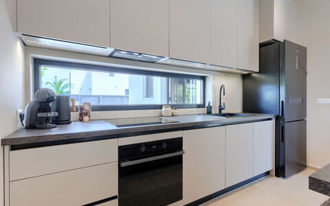 Riata: Kitchen, Kitchen Appliance, Countertop, Interior Design, Wood, Major Appliance, Flooring, Cabinetry, Home Appliance, Lighting