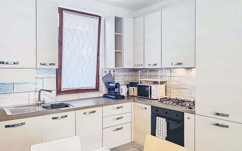 Casa Burli: Kitchen, Kitchen Appliance, Countertop, Cabinetry, Interior Design, Flooring, Major Appliance, Furniture, Wood, Floor