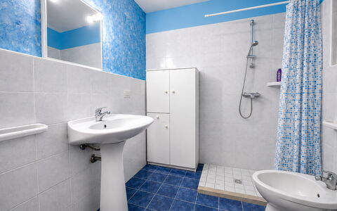 Villa Patrizia: Blue, Plumbing Fixture, Flooring, Bathroom, Floor, Sink, Bathroom Sink, Tile, Plumbing, Interior Design