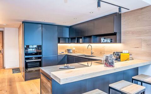 Chesa Zentrum 10B: Kitchen, Furniture, Countertop, Interior Design, Flooring, Kitchen Appliance, Cabinetry, Floor, Wood, Ceiling