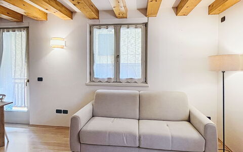 Rugia: Furniture, Interior Design, Flooring, Wall, Wood, Floor, Room, Couch, Ceiling, Living Room