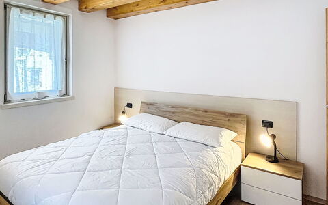 Rugia: Bed, Bedroom, Wall, Interior Design, Flooring, Bedding, Wood, Floor, Bed Sheet, Furniture