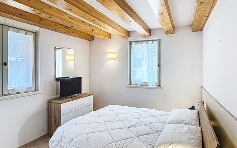 Rugia: Wall, Interior Design, Wood, Bedroom, Bed, Flooring, Floor, Ceiling, Furniture, Room