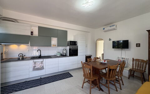 La Casa dei Melograni: Furniture, Kitchen, Flooring, Interior Design, Countertop, Floor, Kitchen Appliance, Cabinetry, Wood, Major Appliance