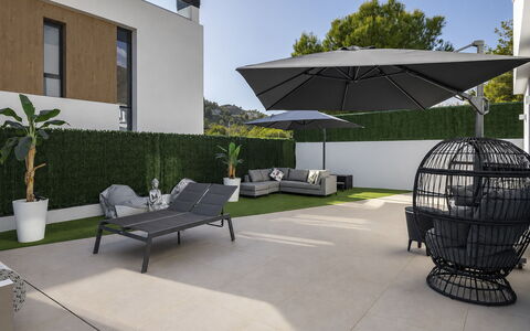 Villa Esencia: Furniture, Outdoor Furniture, Chair, Floor, Flooring, Garden, Outdoor Table, Patio, Shade, Landscaping