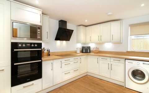 The Cottage: Flooring, Interior Design, Kitchen, Countertop, Wood, Cabinetry, Floor, Ceiling, Major Appliance, Furniture