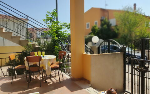 Casa Bianca, Budoni: Furniture, Chair, Balcony, Porch, Outdoor Furniture, Handrail, Wood Stain, Outdoor Table, Houseplant, Flowerpot