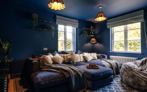 The Old Schoolhouse at Penrhos: Furniture, Blue, Interior Design, Couch, Wall, Flooring, Living Room, Room, Floor, Ceiling