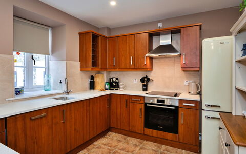 The Kiln: Cabinetry, Flooring, Furniture, Kitchen, Countertop, Wood, Kitchen Appliance, Major Appliance, Drawer, Interior Design