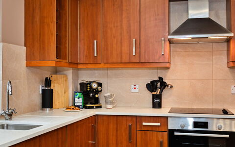 The Kiln: Cabinetry, Kitchen Appliance, Kitchen, Countertop, Furniture, Wood, Major Appliance, Cupboard, Flooring, Drawer
