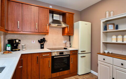 The Kiln: Cabinetry, Furniture, Kitchen Appliance, Countertop, Drawer, Major Appliance, Kitchen, Wood, Flooring, Cupboard
