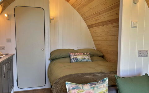 Whinfell Pod: Interior Design, Floor, Bedroom, Bed, Wood Stain, Pillow, Hardwood, Bed Frame, Bedding, Throw Pillow