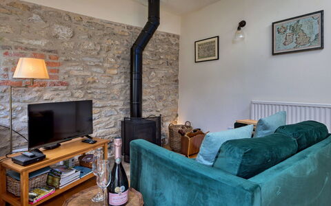 Mole End: Furniture, Interior Design, Wall, Flooring, Floor, Living Room, Couch, Hearth, Room, Lighting